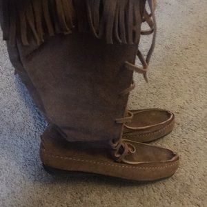 A pair of suede brown boots